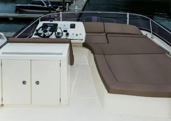 Slide: The Image of Flybridge of 2014 Prestige 550 Fly yacht with helm and sunbathing area. - 11