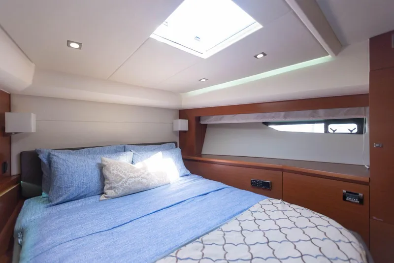 Slide: The Image of Luxurious bedroom interior of 2014 Prestige 550 Fly yacht with skylight and elegant bedding. - 25