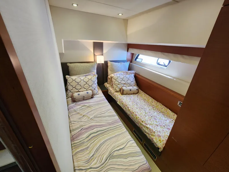 Slide: The Image of Twin cabin interior of 2014 Prestige 550 Fly yacht with cozy bedding and modern design. - 28