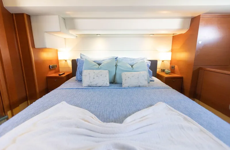 Slide: The Image of Luxurious bedroom interior of 2014 Prestige 550 Fly yacht with elegant bedding and warm lighting. - 32