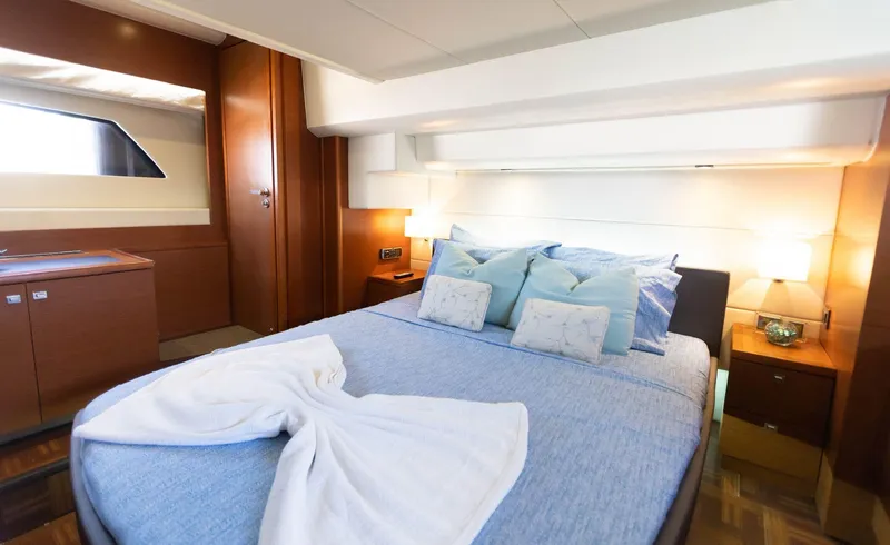Slide: The Image of Luxurious bedroom interior of 2014 Prestige 550 Fly yacht with elegant bedding and ambient lighting. - 33