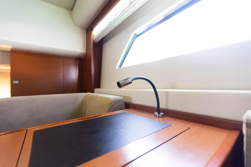 Slide: The Image of Interior of 2014 Prestige 550 Fly yacht with sleek desk and modern lighting. - 34