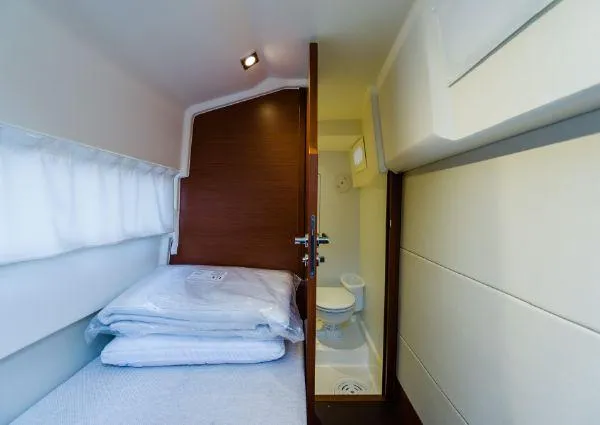 Slide: The Image of 2014 Prestige 550 Fly cabin interior with bed and compact bathroom. - 39