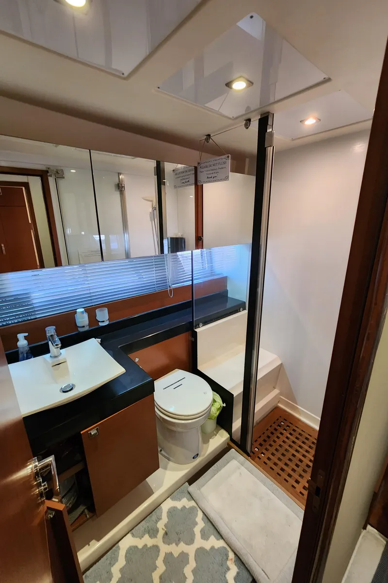 Slide: The Image of Luxury bathroom in 2014 Prestige 550 Fly yacht with modern fixtures and elegant design. - 40
