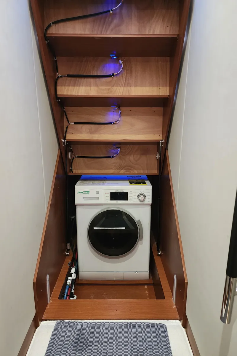 Slide: The Image of Laundry area with washing machine in 2014 Prestige 550 Fly yacht. - 43