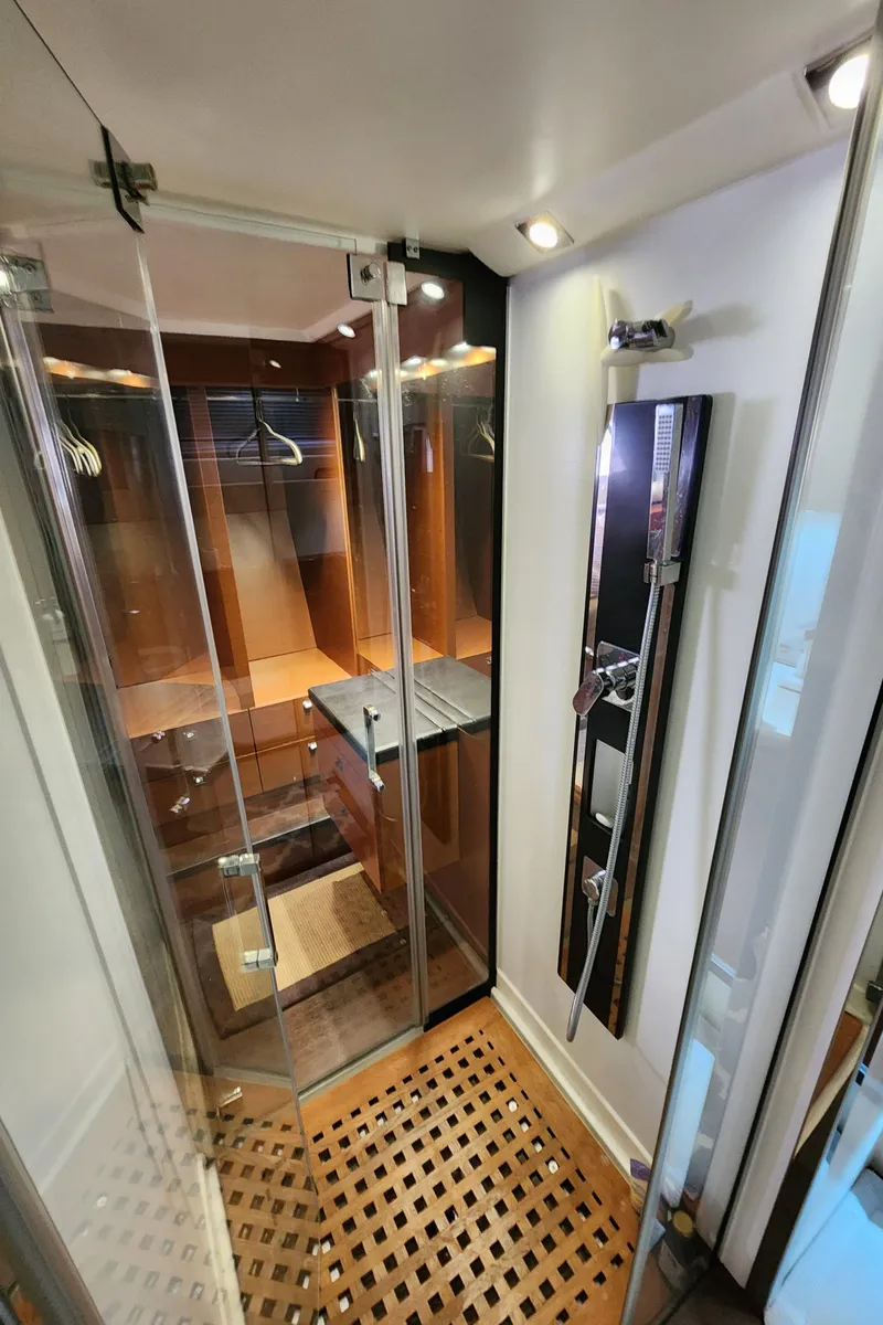 Slide: The Image of Luxurious shower area in 2014 Prestige 550 Fly yacht with glass doors and wooden flooring. - 44