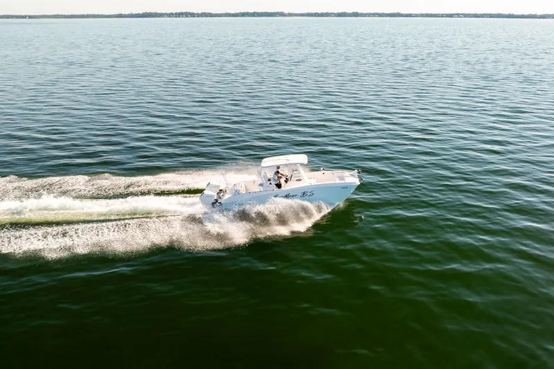 Slide: The Image of 2023 Twin Vee 260 GFX CC boat on open water. - 13