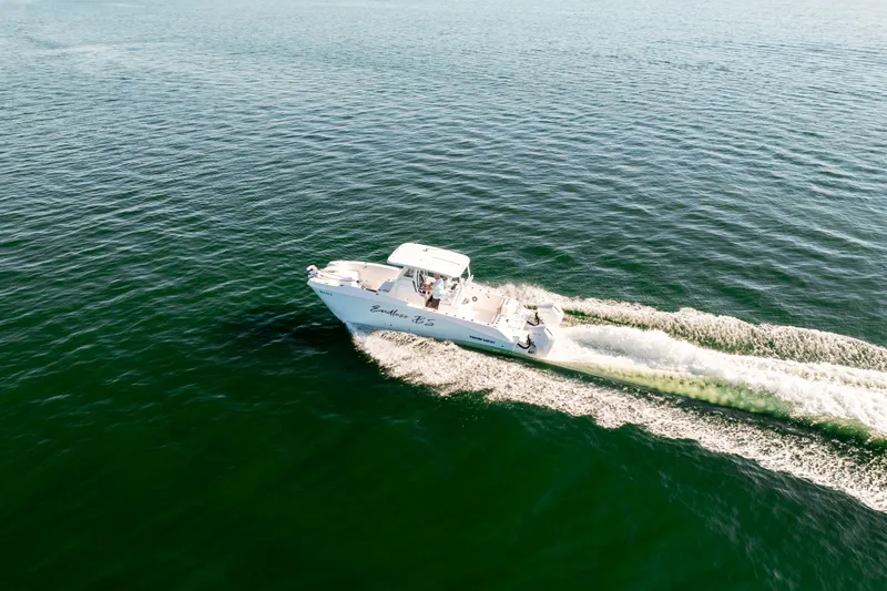 Slide: The Image of Twin Vee 260 GFX CC 2023 cruising on open water. - 18