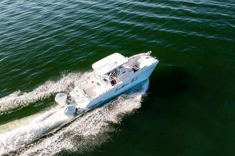Slide: The Image of 2023 Twin Vee 260 GFX CC boat cruising on open water. - 19