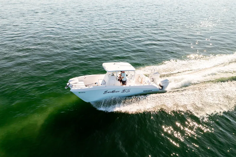 Slide: The Image of 2023 Twin Vee 260 GFX CC boat on open water. - 21