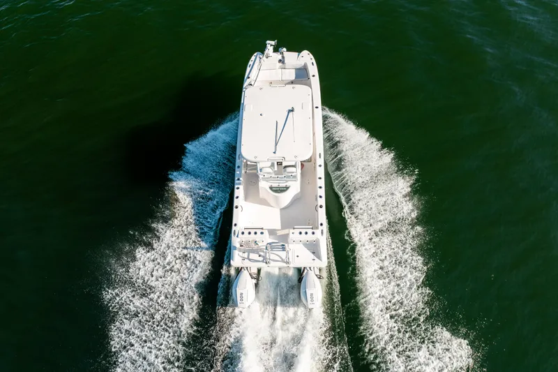 Slide: The Image of Aerial view of Twin Vee 260 GFX CC boat on the water. - 24