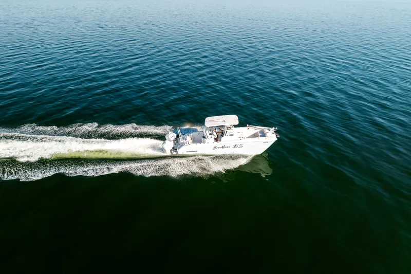 Slide: The Image of 2023 Twin Vee 260 GFX CC boat on open water. - 26