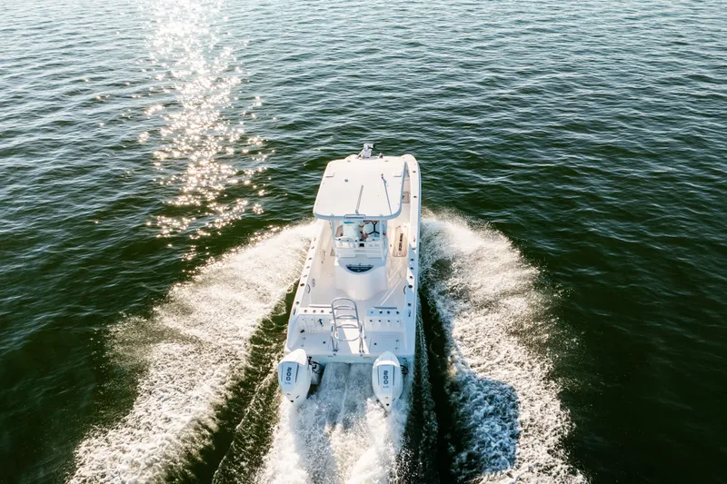 Slide: The Image of 2023 Twin Vee 260 GFX CC boat on open water. - 27