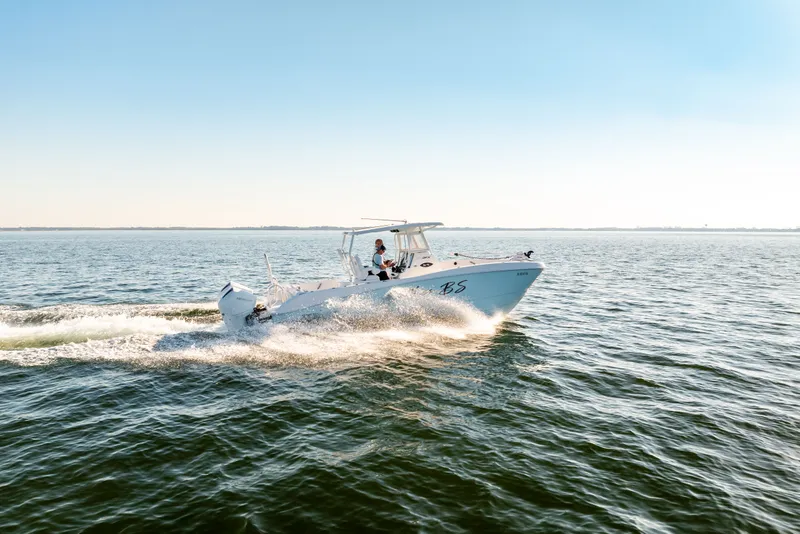 Slide: The Image of 2023 Twin Vee 260 GFX CC boat cruising on open water. - 30