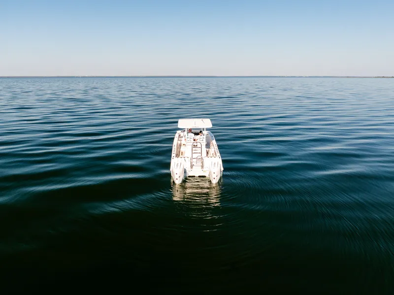 Slide: The Image of 2023 Twin Vee 260 GFX CC on calm sea. - 4