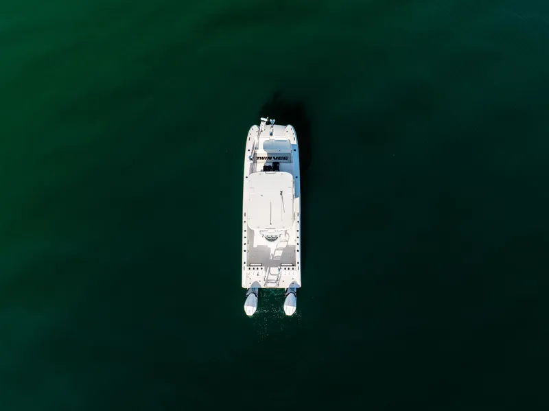 Slide: The Image of Aerial view of 2023 Twin Vee 260 GFX CC on calm water. - 5