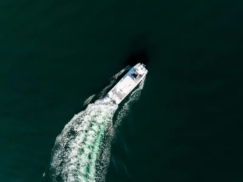 Slide: The Image of Aerial view of 2023 Twin Vee 260 GFX CC on open water. - 6