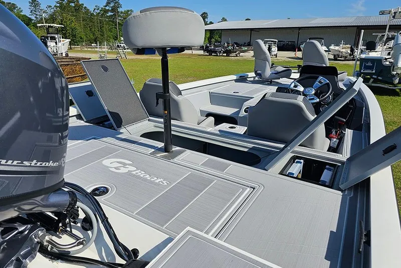 Slide: The Image of 2026 G3 Sportsman 1810 SE boat with open storage compartments and seating. - 11