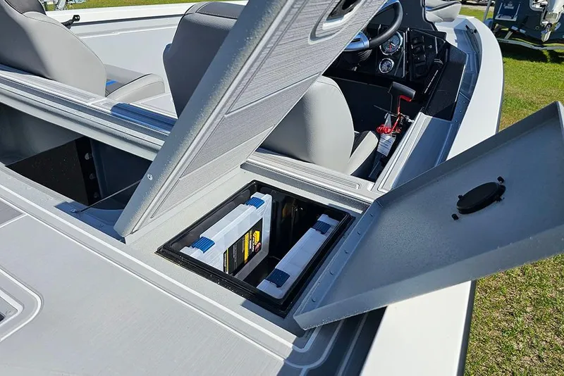 Slide: The Image of 2026 G3 Sportsman 1810 SE boat with open storage compartment and visible seating. - 12