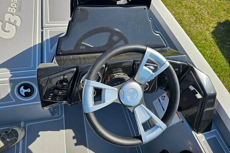 Slide: The Image of Steering console of 2026 G3 Sportsman 1810 SE boat, featuring modern controls. - 18