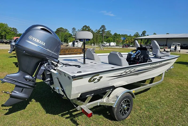 Slide: The Image of 2026 G3 Sportsman 1810 SE boat with Yamaha motor on trailer, parked on grass. - 3