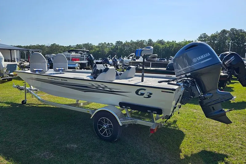 Slide: The Image of 2026 G3 Sportsman 1810 SE boat with Yamaha motor on trailer, parked on grass. - 7