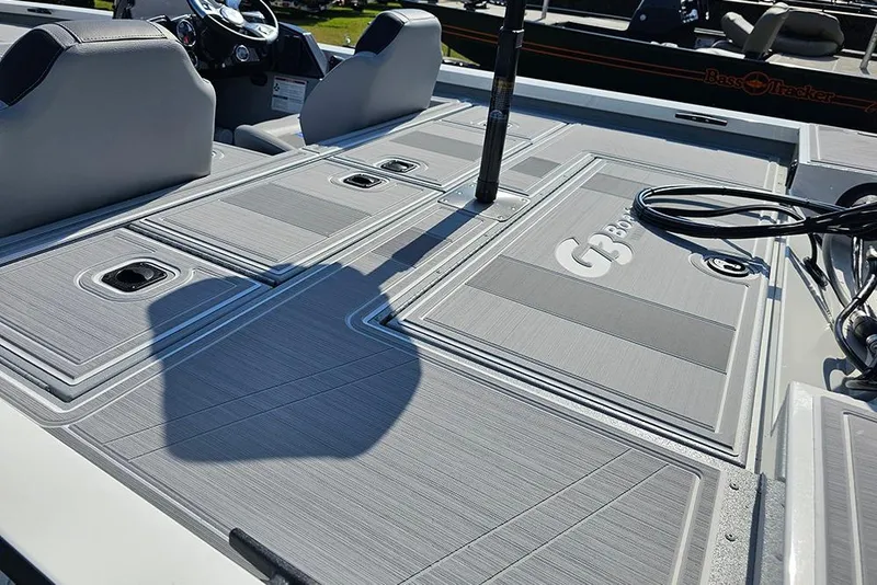 Slide: The Image of 2026 G3 Sportsman 1810 SE boat deck with seating and storage compartments. - 9