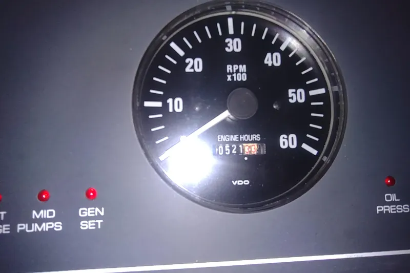 Slide: The Image of Tachometer and engine hours display on 2003 Tiara Yachts 3100 Open LE dashboard. - 18
