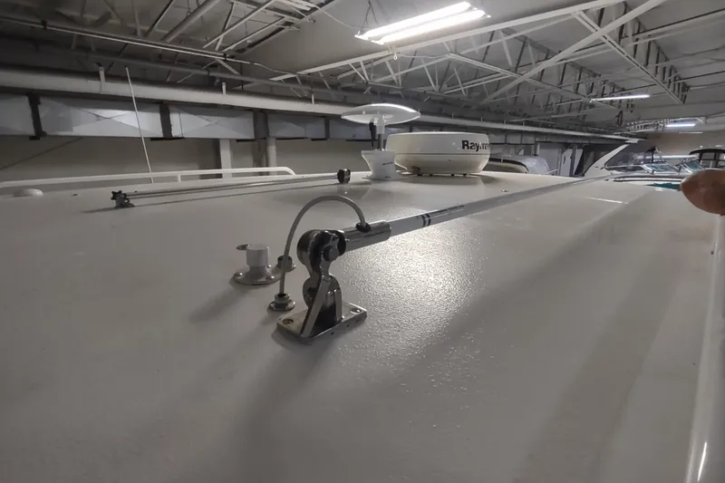 Slide: The Image of 2003 Tiara Yachts 3100 Open LE boat roof with radar equipment in a warehouse. - 20