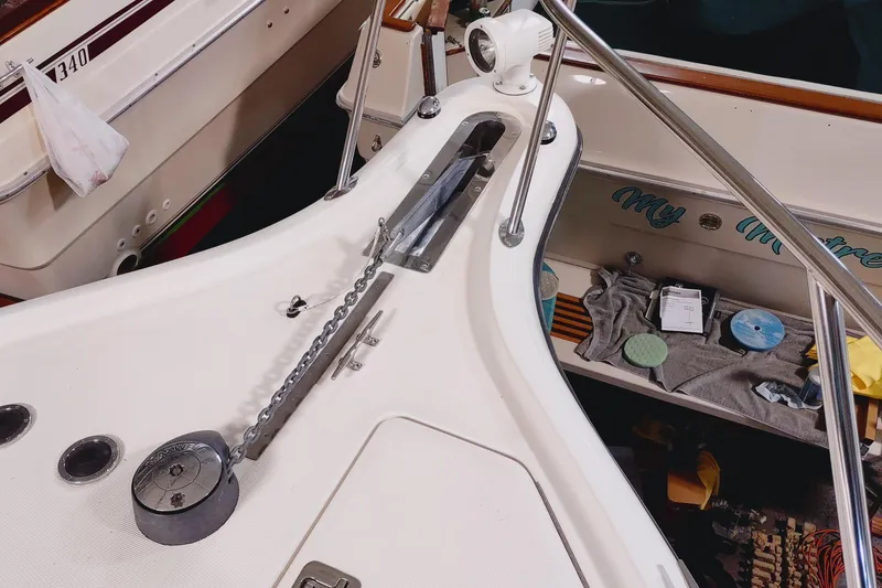 Slide: The Image of 2003 Tiara Yachts 3100 Open LE bow with anchor chain and deck details. - 21