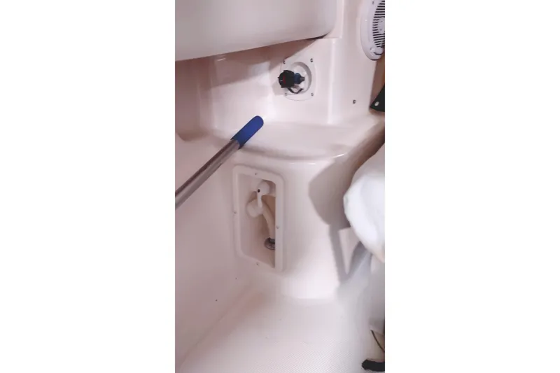 Slide: The Image of Interior detail of 2003 Tiara Yachts 3100 Open LE, featuring control panel and storage compartment. - 22