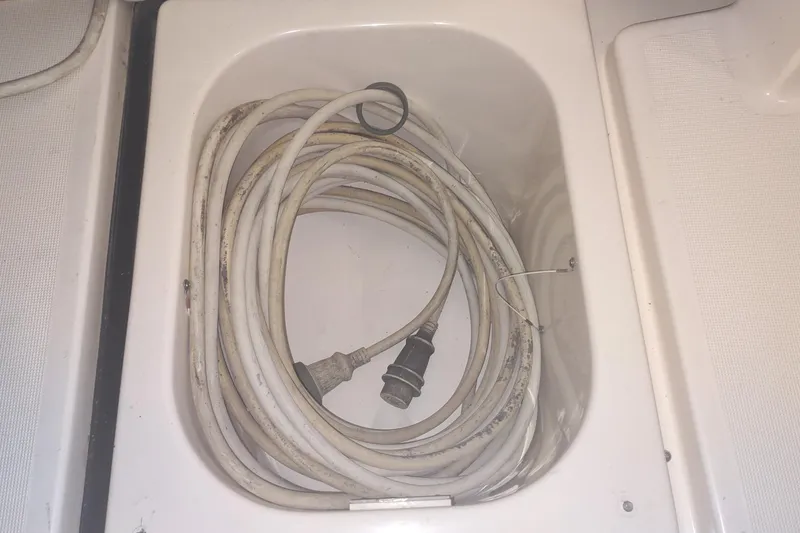 Slide: The Image of Coiled power cable in storage compartment of 2003 Tiara Yachts 3100 Open LE. - 26