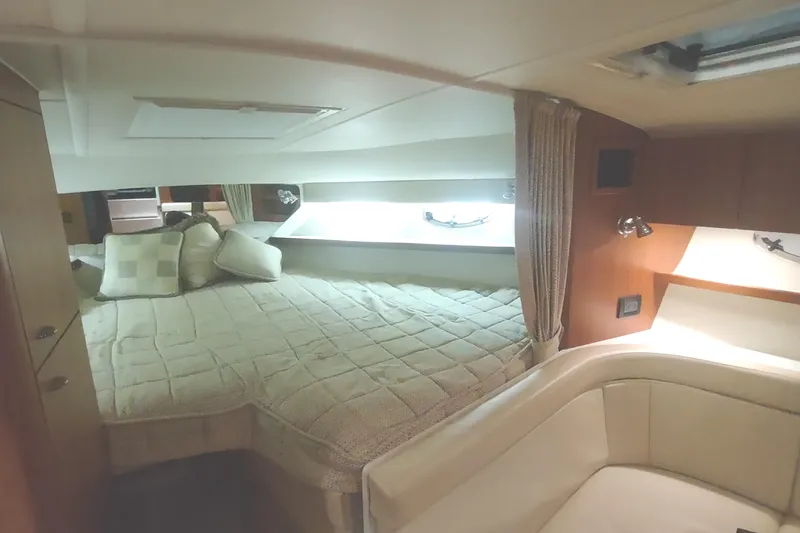 Slide: The Image of Interior cabin of 2003 Tiara Yachts 3100 Open LE with cozy bed and seating area. - 30