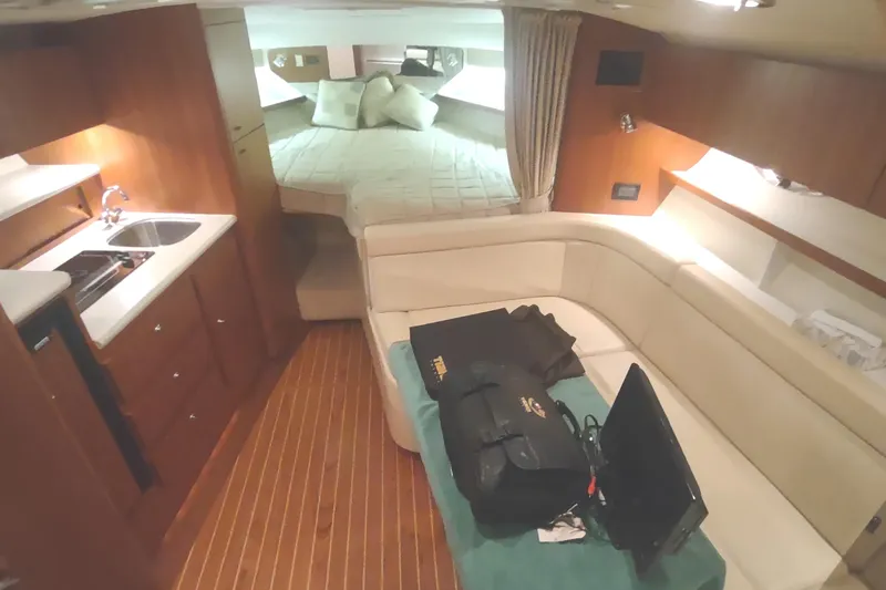 Slide: The Image of Interior of 2003 Tiara Yachts 3100 Open LE with cozy seating and kitchenette. - 35