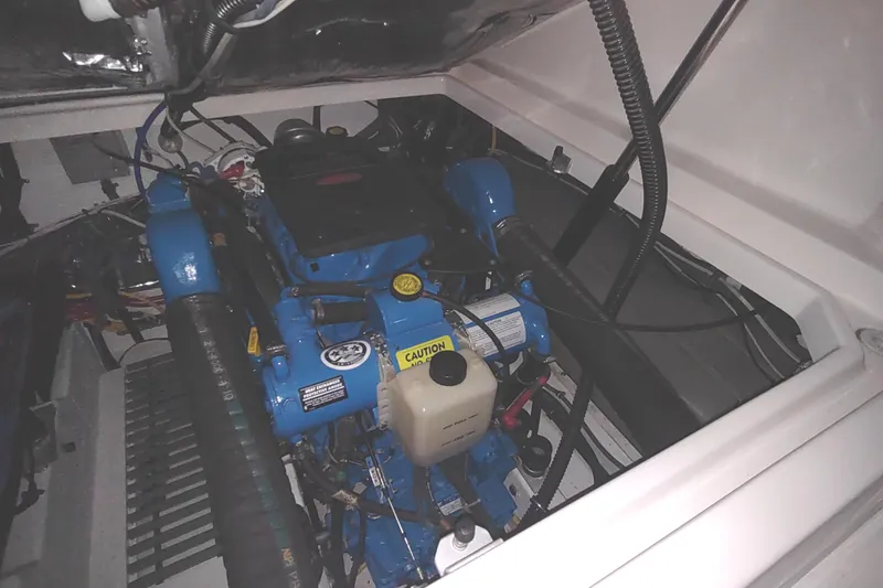 Slide: The Image of Engine compartment of a 2003 Tiara Yachts 3100 Open LE, showcasing the boat's machinery. - 37