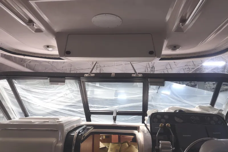 Slide: The Image of Interior view of 2003 Tiara Yachts 3100 Open LE helm with covered windows. - 4