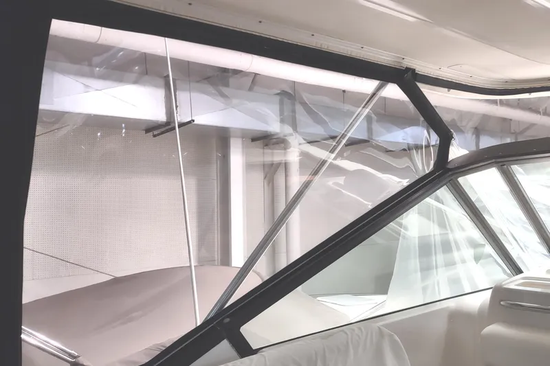 Slide: The Image of Interior view of a 2003 Tiara Yachts 3100 Open LE, showcasing clear windows and sleek design. - 6