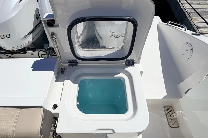 Slide: The Image of Livewell on 2020 Pursuit OS 355 Offshore boat, featuring Yamaha 300 outboard engines. - 12
