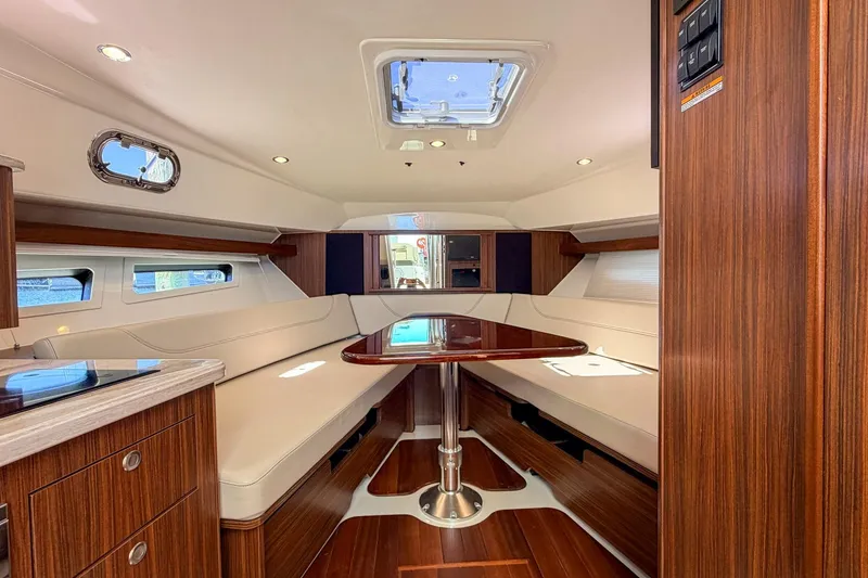 Slide: The Image of Luxurious interior of 2020 Pursuit OS 355 Offshore yacht with elegant wood finishes. - 24