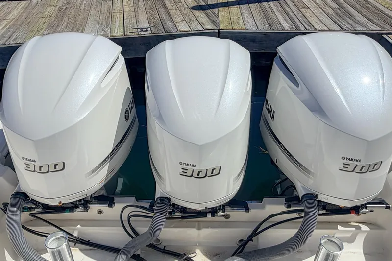 Slide: The Image of Triple Yamaha 300 outboard engines on a 2020 Pursuit OS 355 Offshore boat. - 29