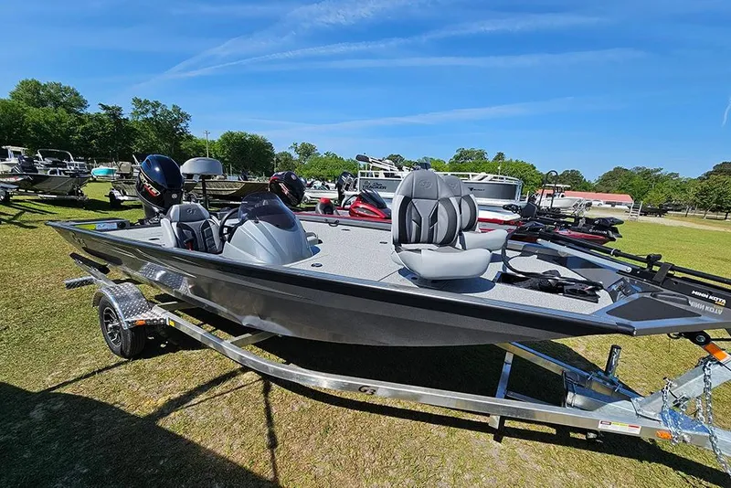 The Image of 2026 G3 Sportsman 1710 boat on trailer, displayed outdoors under clear blue sky. - 1