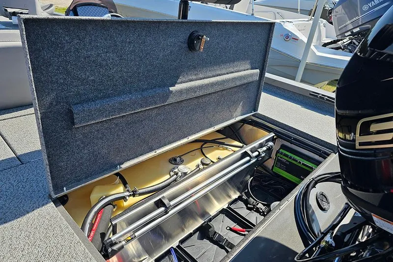 Slide: The Image of Open storage compartment of 2026 G3 Sportsman 1710 boat, showcasing internal components. - 11