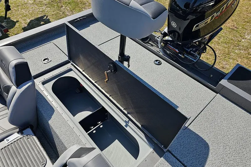 Slide: The Image of 2026 G3 Sportsman 1710 boat interior with open storage compartment and seating. - 13