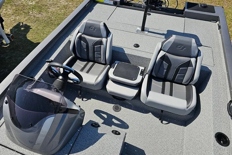 Slide: The Image of 2026 G3 Sportsman 1710 boat interior with dual seats and steering console. - 14