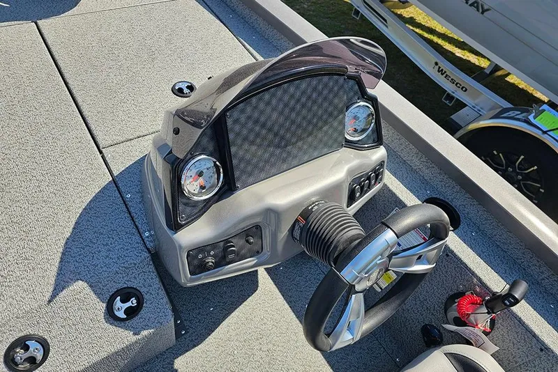 Slide: The Image of Dashboard of 2026 G3 Sportsman 1710 boat with steering wheel and gauges. - 17