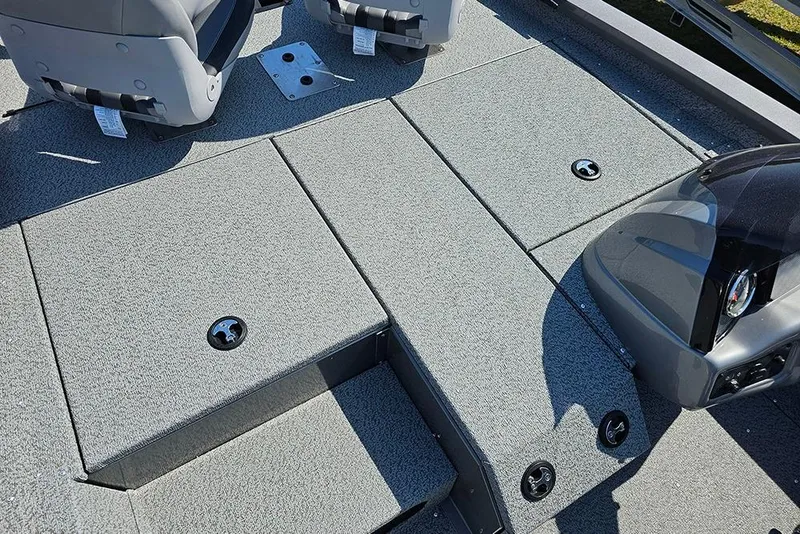 Slide: The Image of 2026 G3 Sportsman 1710 boat deck with seating and storage compartments. - 19