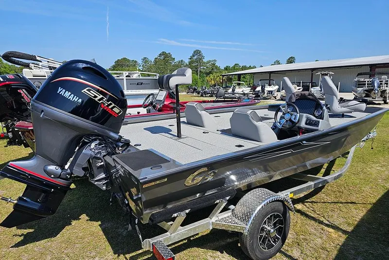Slide: The Image of 2026 G3 Sportsman 1710 boat with Yamaha engine on display outdoors. - 3