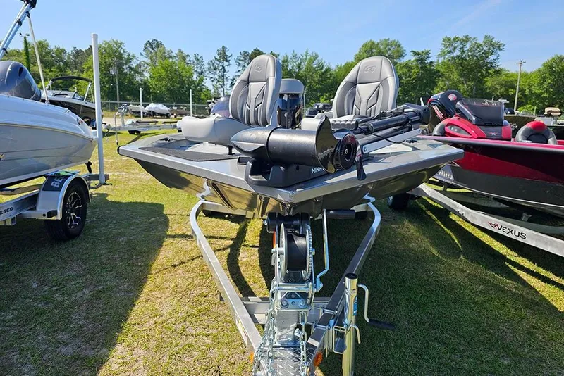 Slide: The Image of 2026 G3 Sportsman 1710 boat on trailer, displayed outdoors with other boats. - 5