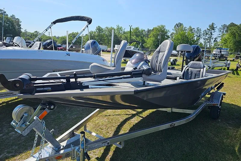 Slide: The Image of 2026 G3 Sportsman 1710 fishing boat on trailer, featuring Minn Kota trolling motor. - 7