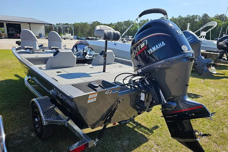 Slide: The Image of 2026 G3 Sportsman 1710 boat with Yamaha engine on trailer, parked outdoors. - 8